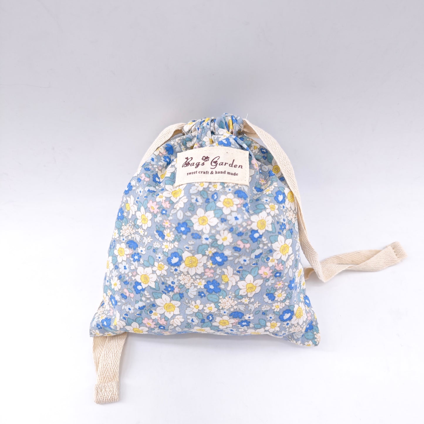 Small cotton bag with floral print and drawstring closure