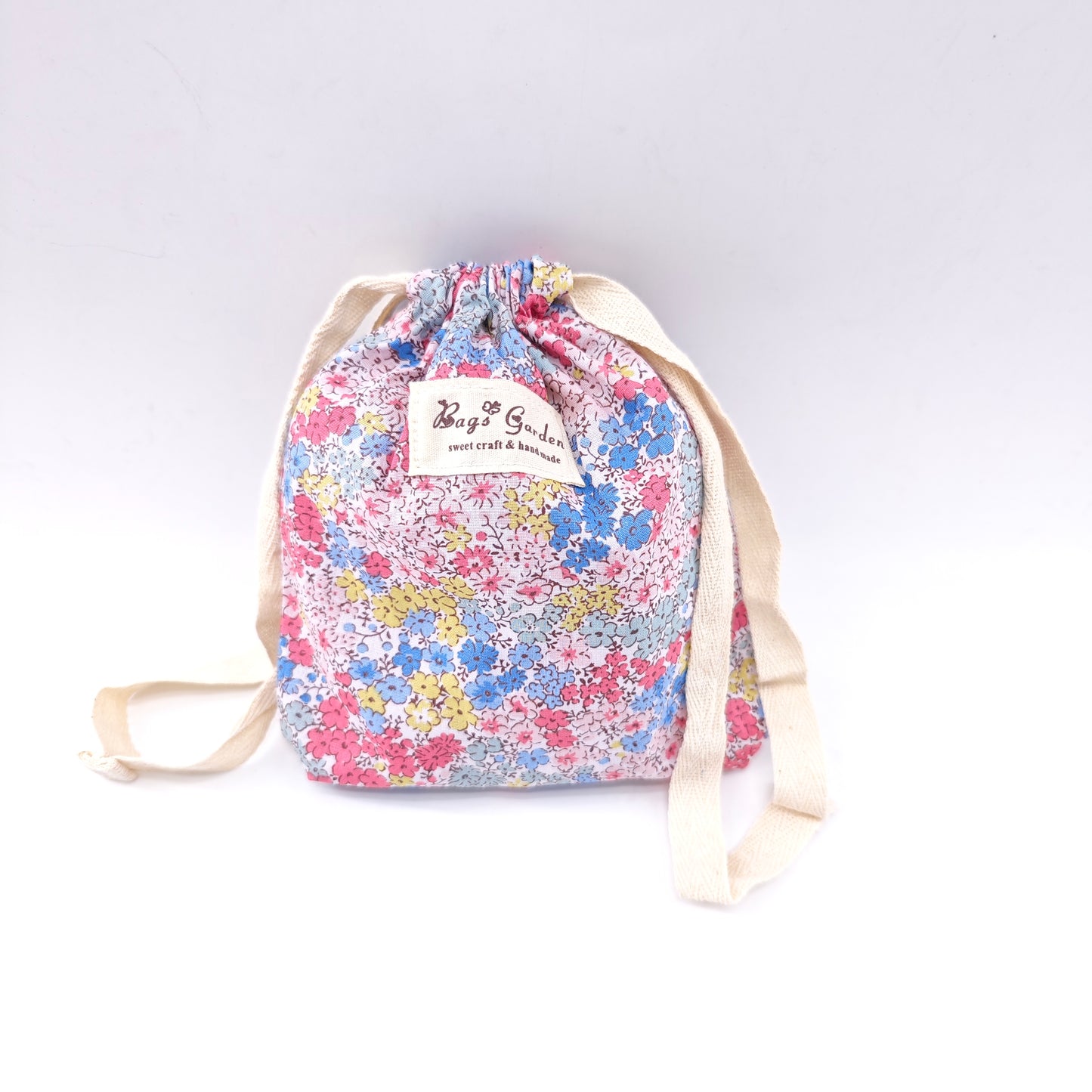 Small cotton bag with floral print and drawstring closure