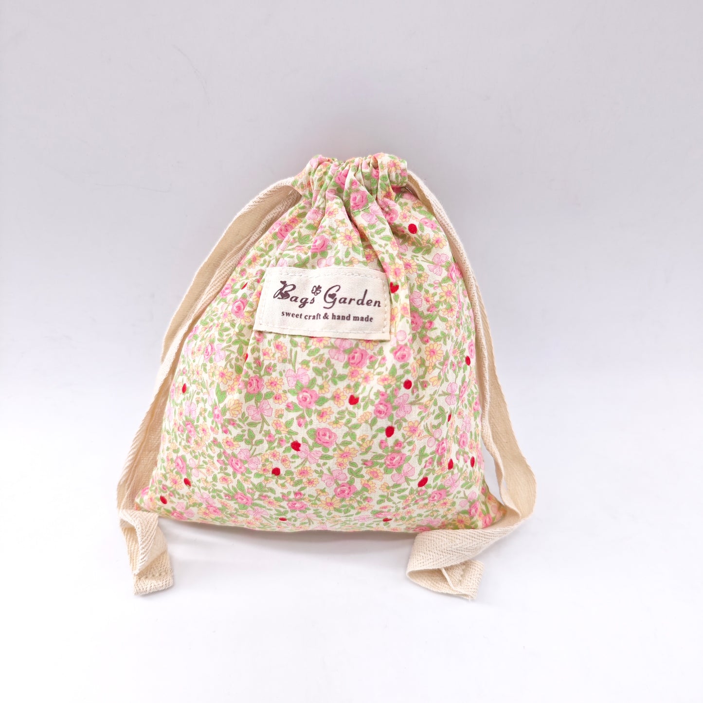 Small cotton bag with floral print and drawstring closure