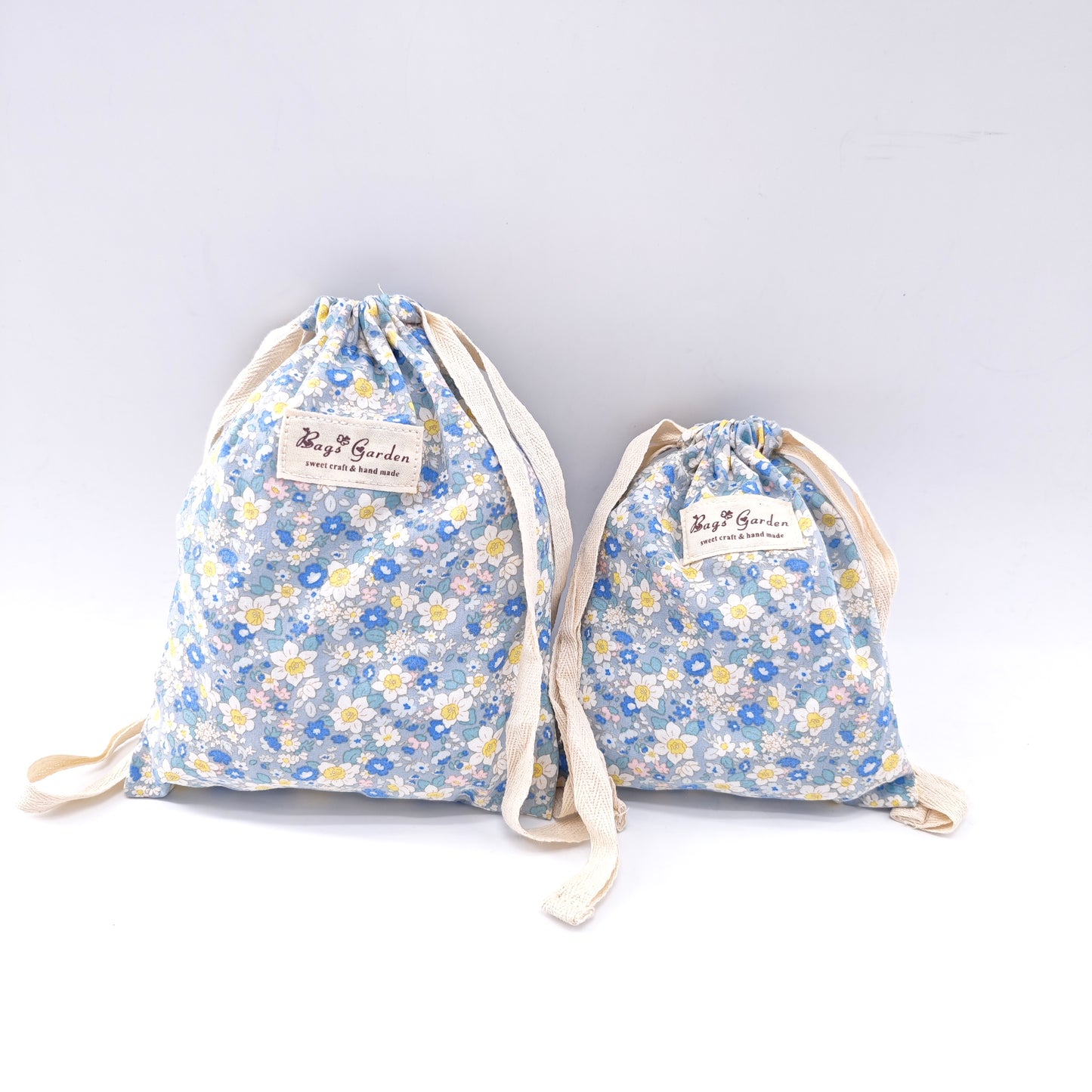 Large cotton bag with floral print and drawstring closure