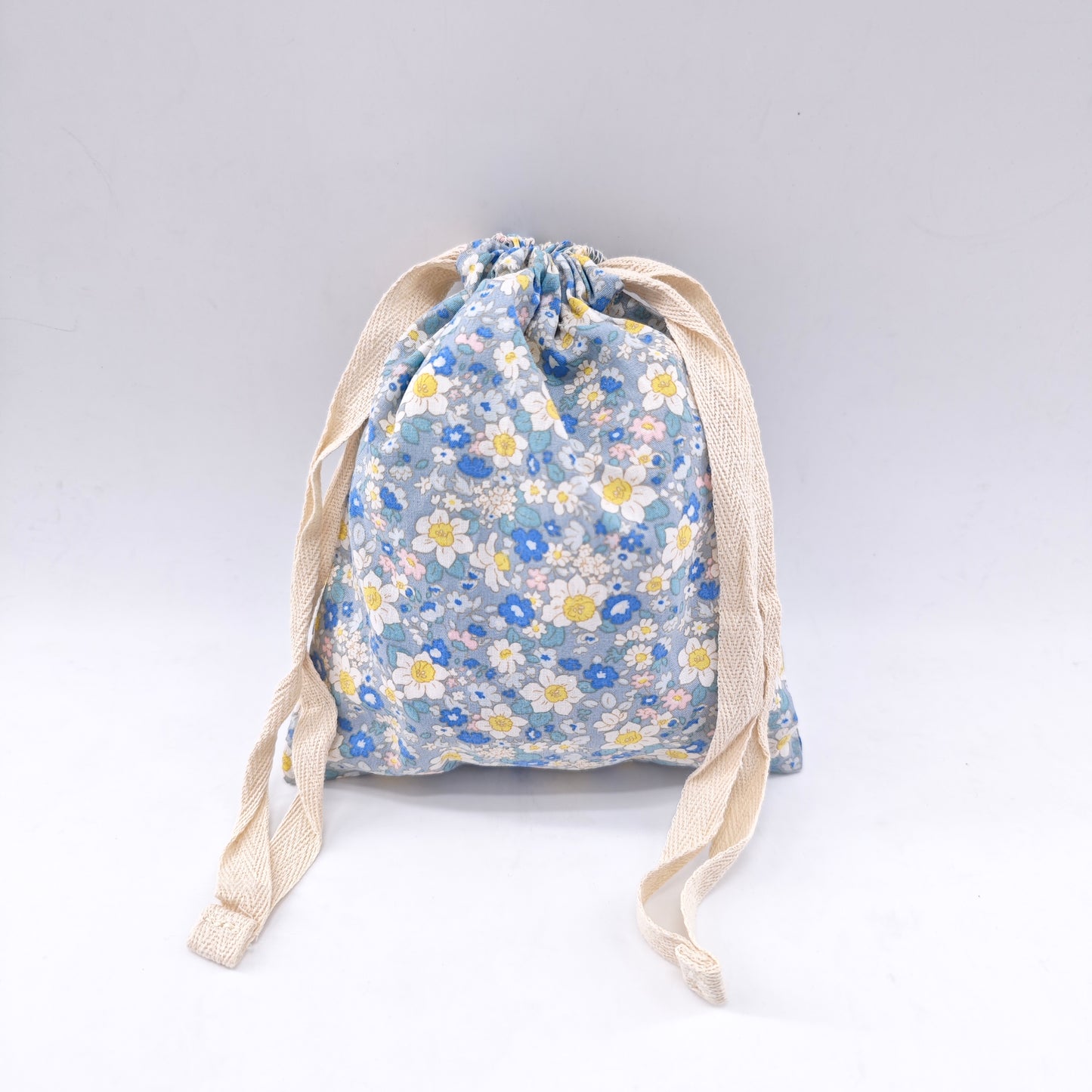 Small cotton bag with floral print and drawstring closure