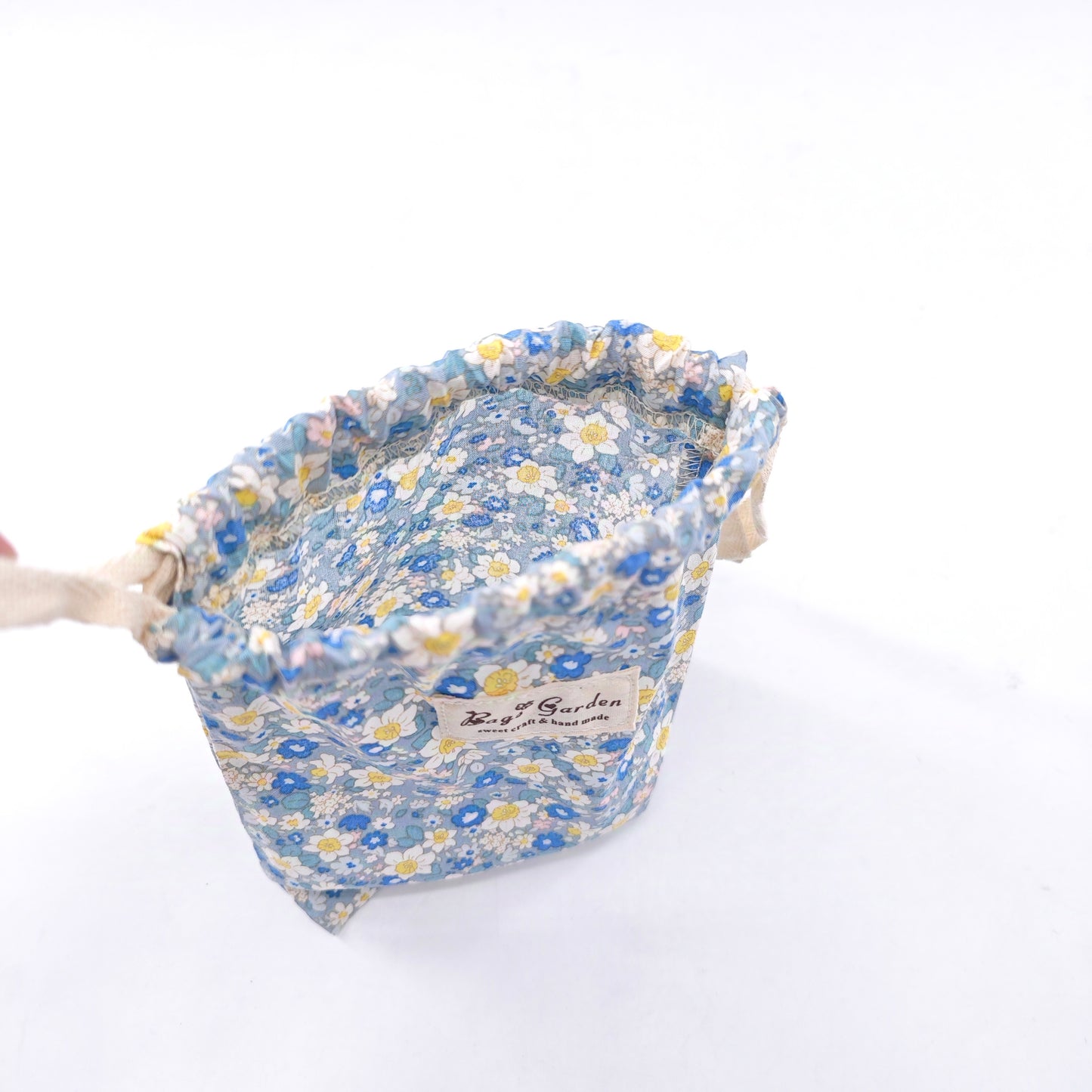 Small cotton bag with floral print and drawstring closure