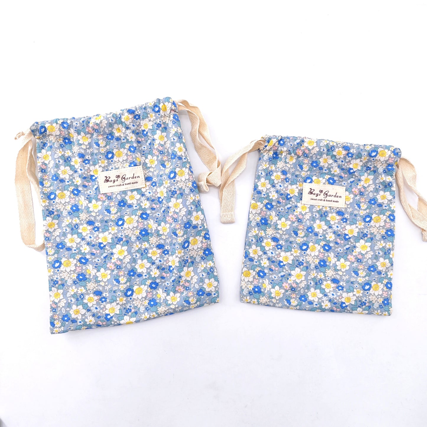 Small cotton bag with floral print and drawstring closure