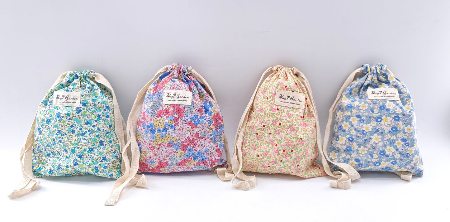 Large cotton bag with floral print and drawstring closure