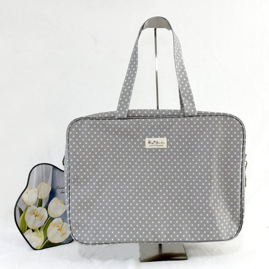 Maletita impermeable de lunares grande