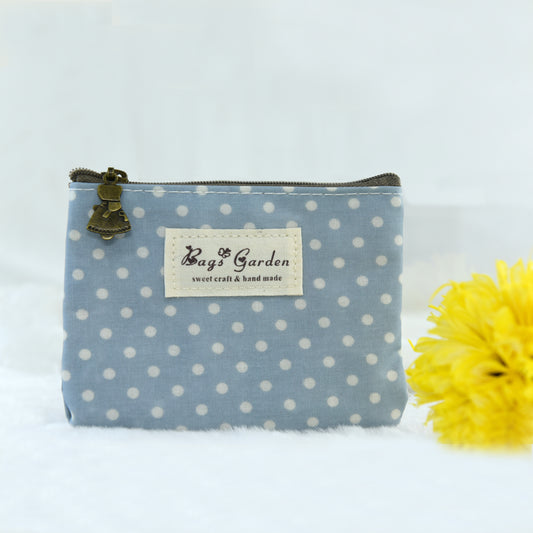 Monedero impermeable de lunares
