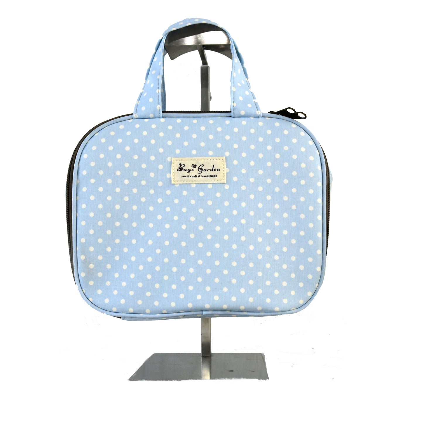 Hanging travel toiletry bag in polka dot cotton
