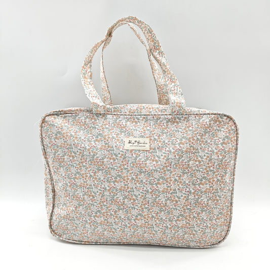 Maletita grande impermeable de flores