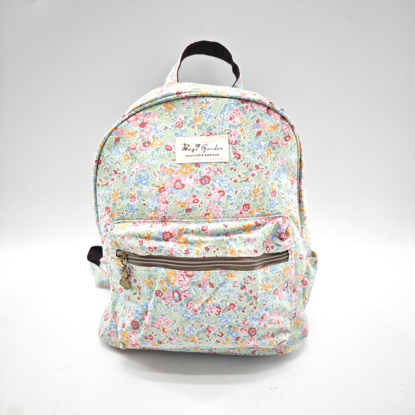 Mochila impermeable con flores – formato pequeño