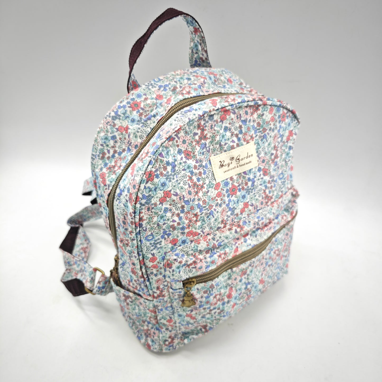 Mochila impermeable con flores – formato pequeño