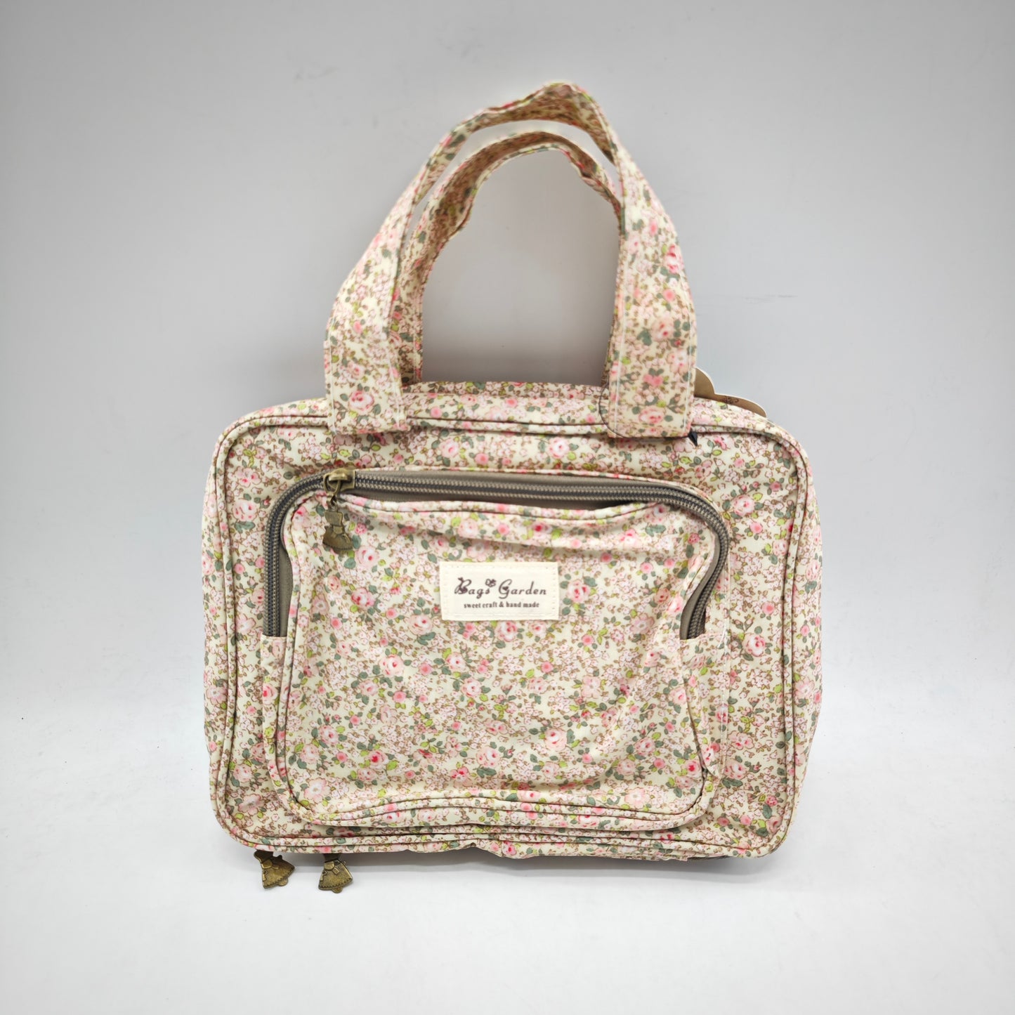 Neceser pequeño colgable impermeable de flores