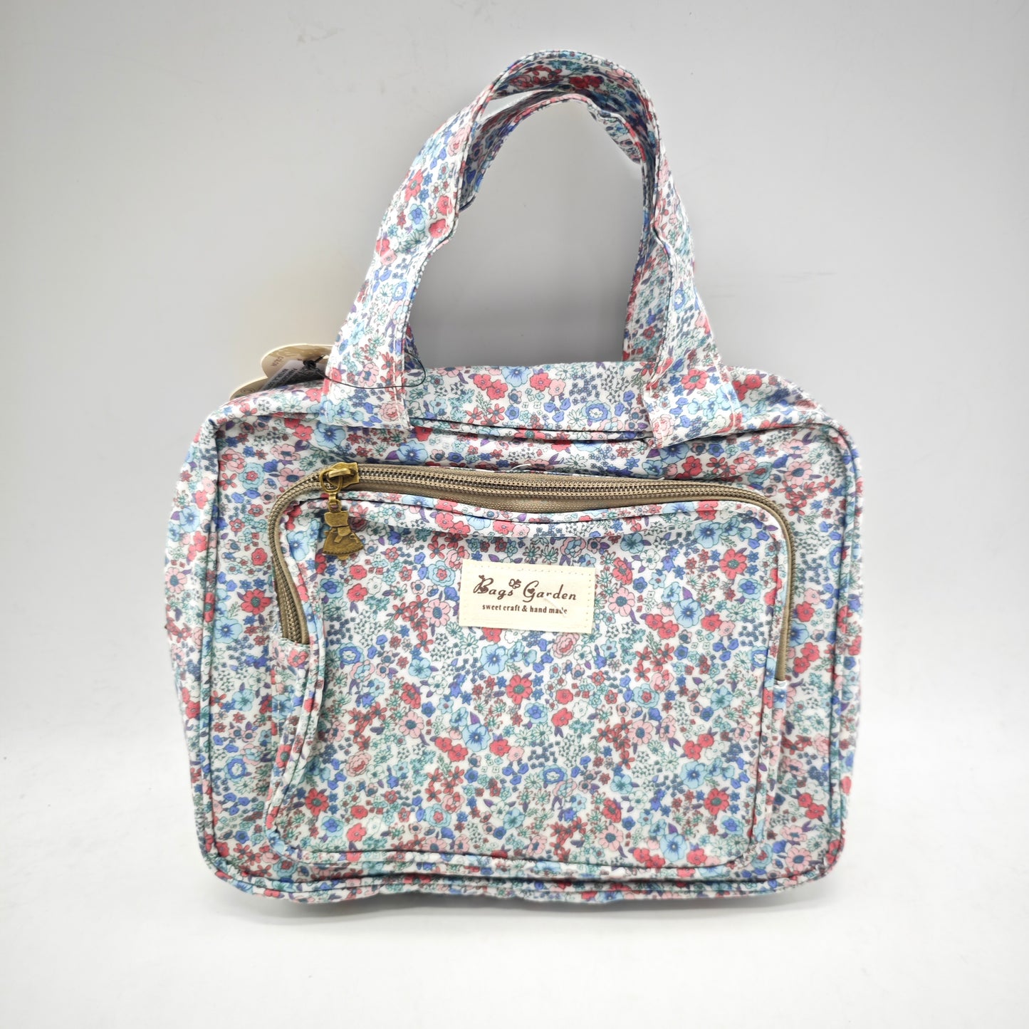 Neceser pequeño colgable impermeable de flores