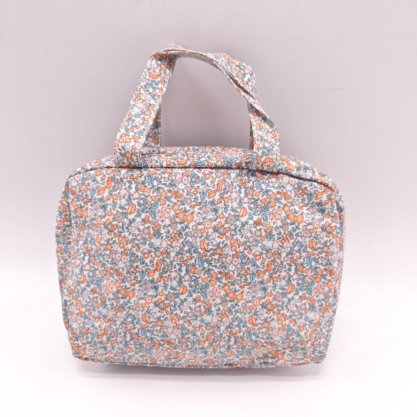 Neceser doble impermeable con estampado flora