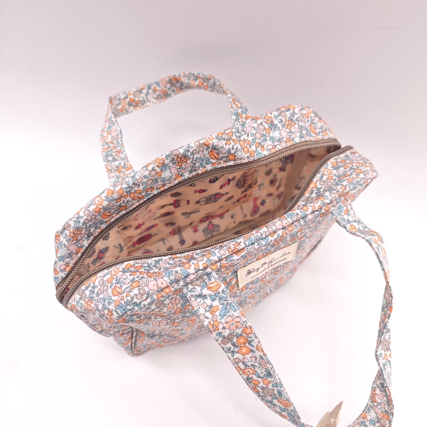 Bolso de mano impermeable con flores – formato cuadrado