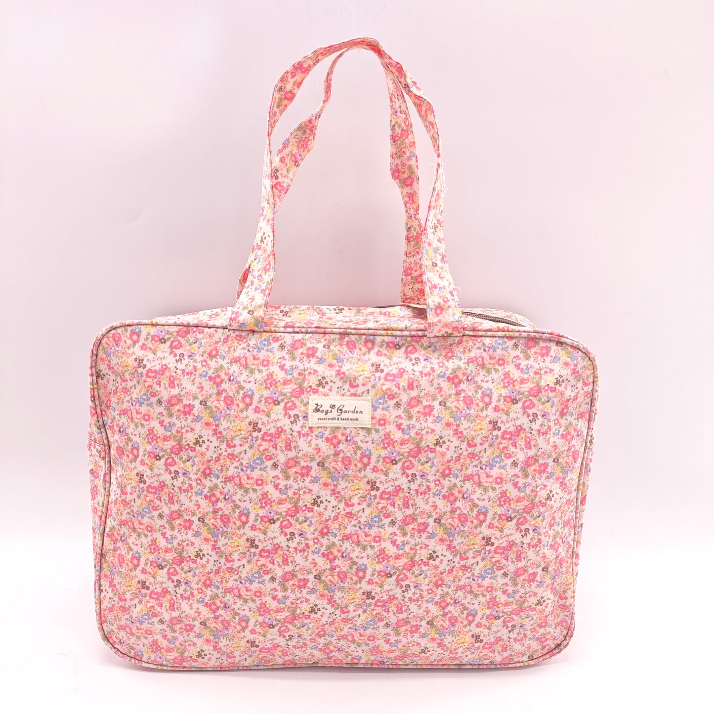 Maletita grande impermeable de flores