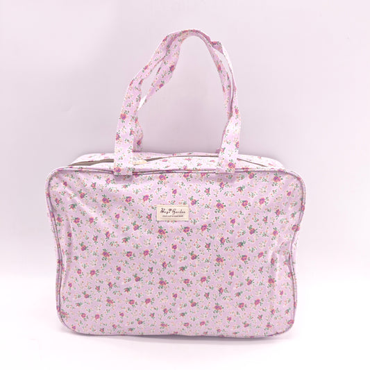 Maletita grande impermeable de flores