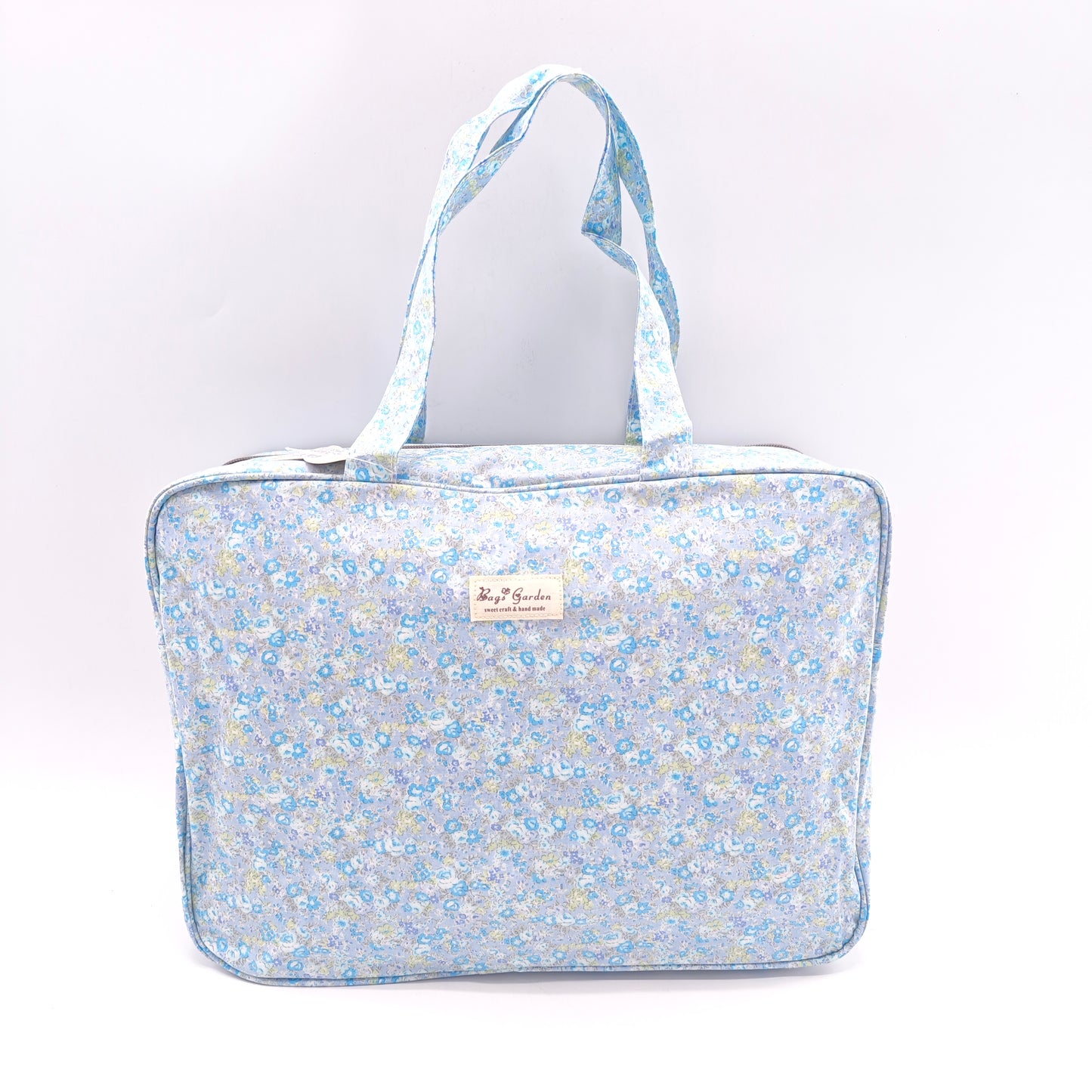 Maletita grande impermeable de flores