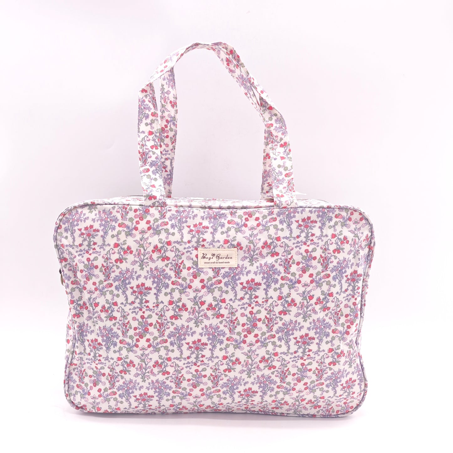 Maletita grande impermeable de flores