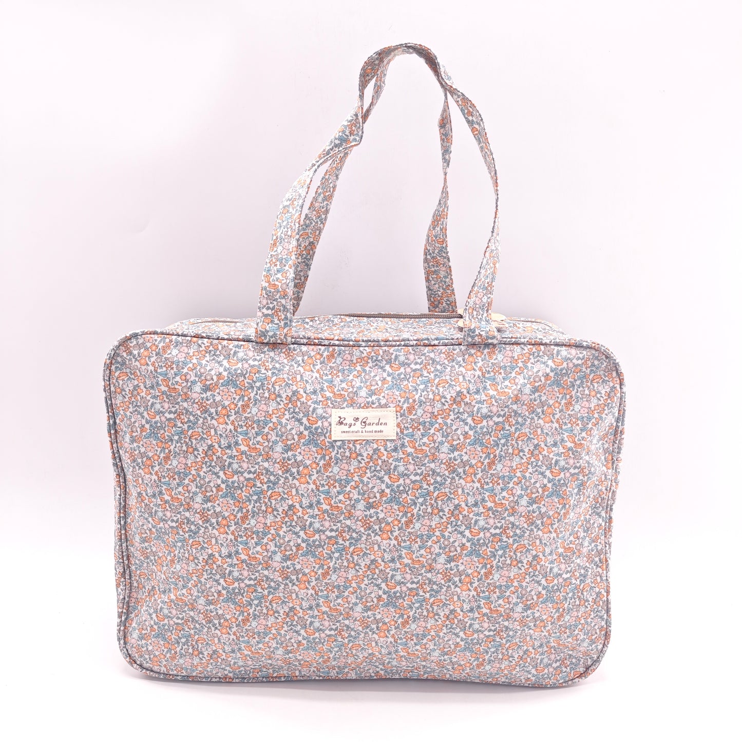 Maletita grande impermeable de flores