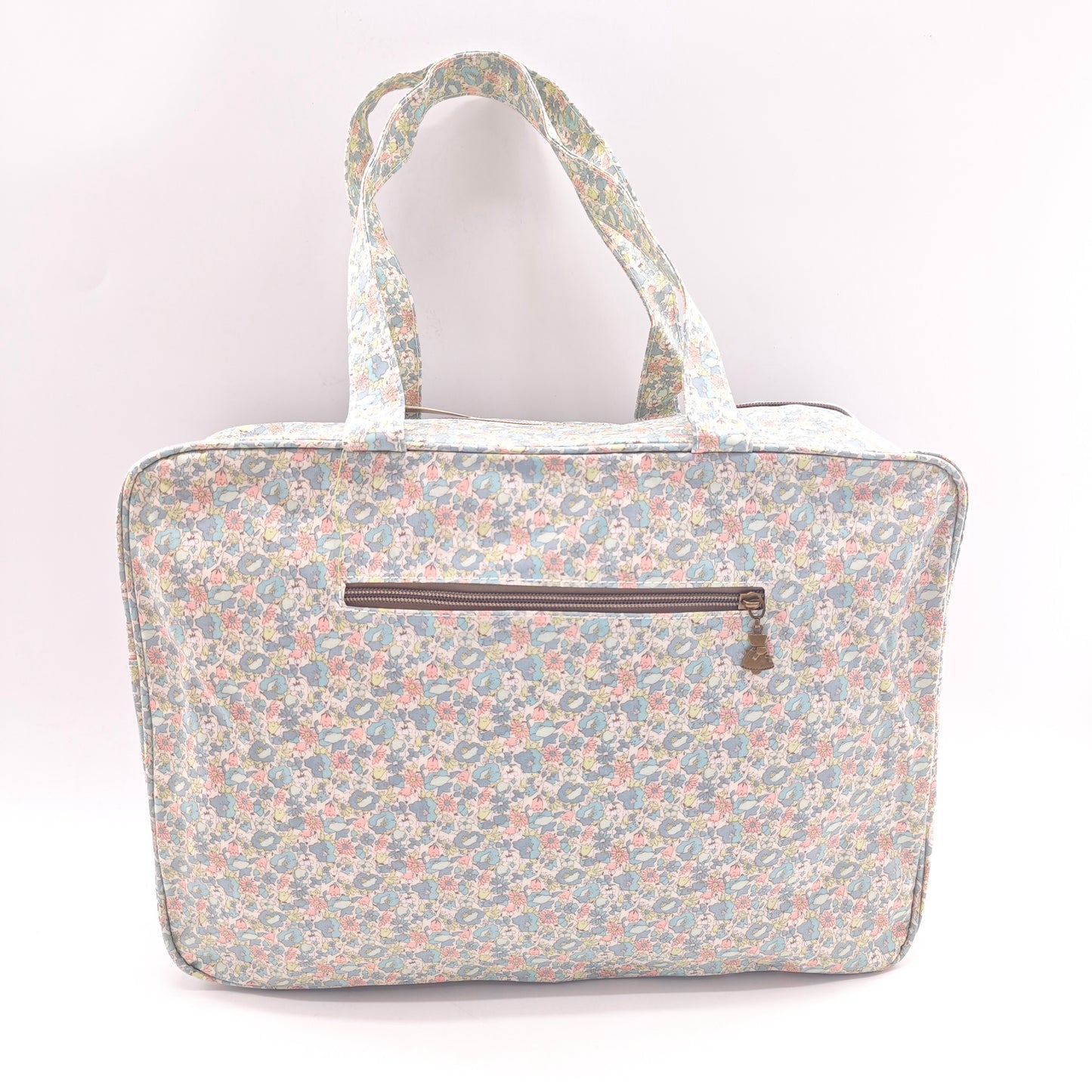 Maletita grande impermeable de flores