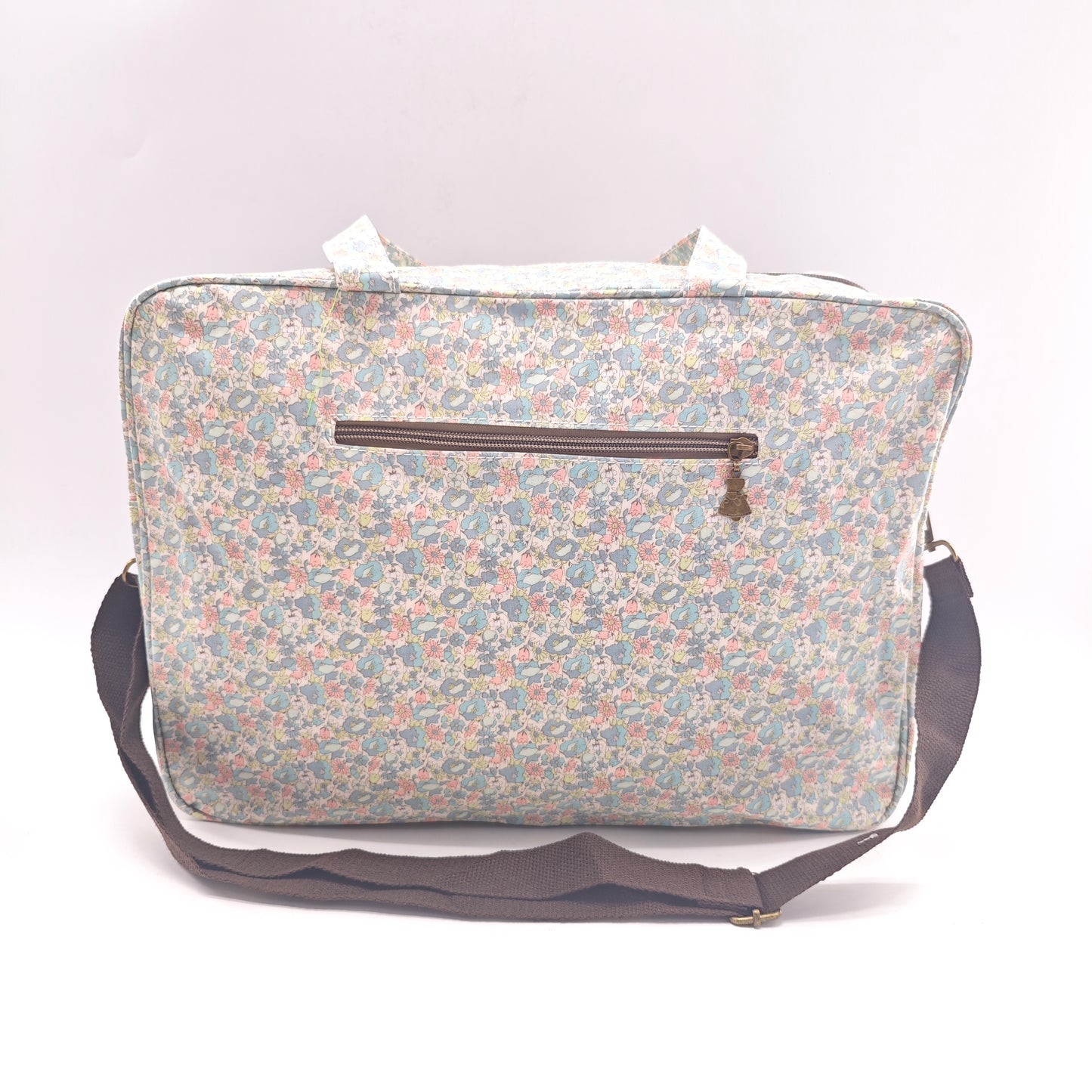 Maletita grande impermeable de flores