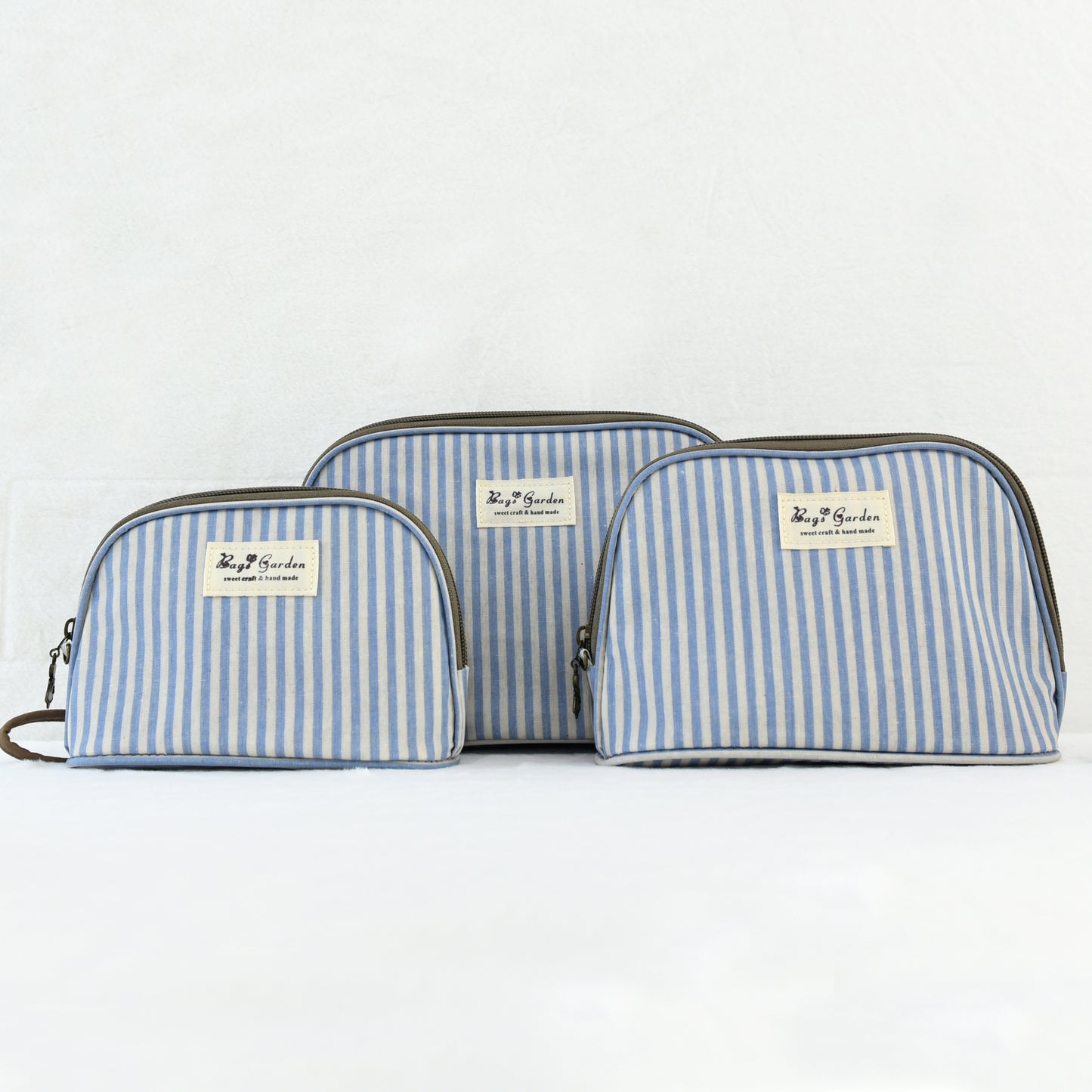 Neceser impermeable de rayas de 3 piezas con asa de mano