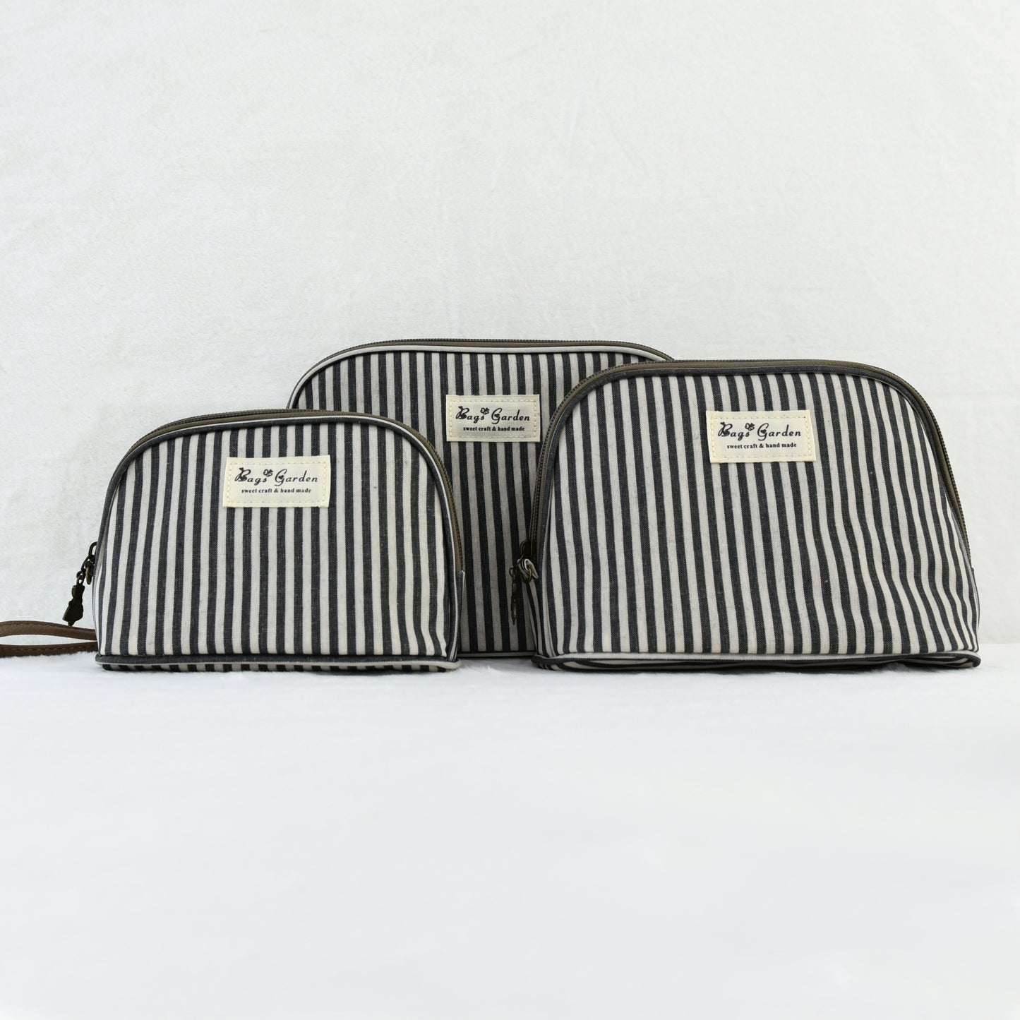 Neceser impermeable de rayas de 3 piezas con asa de mano