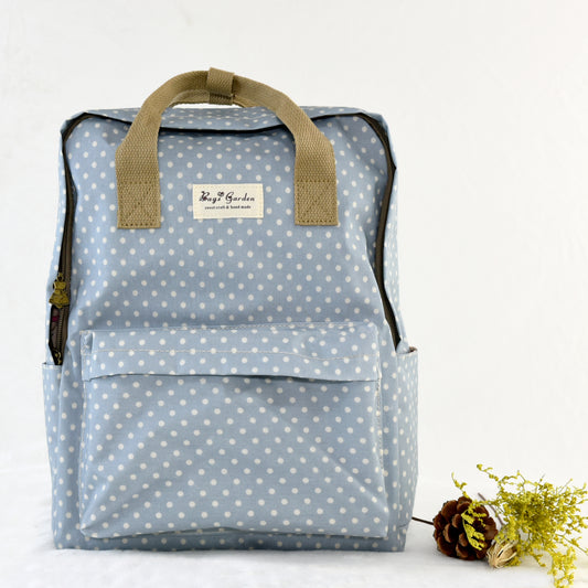 Polka dot raincoat backpack