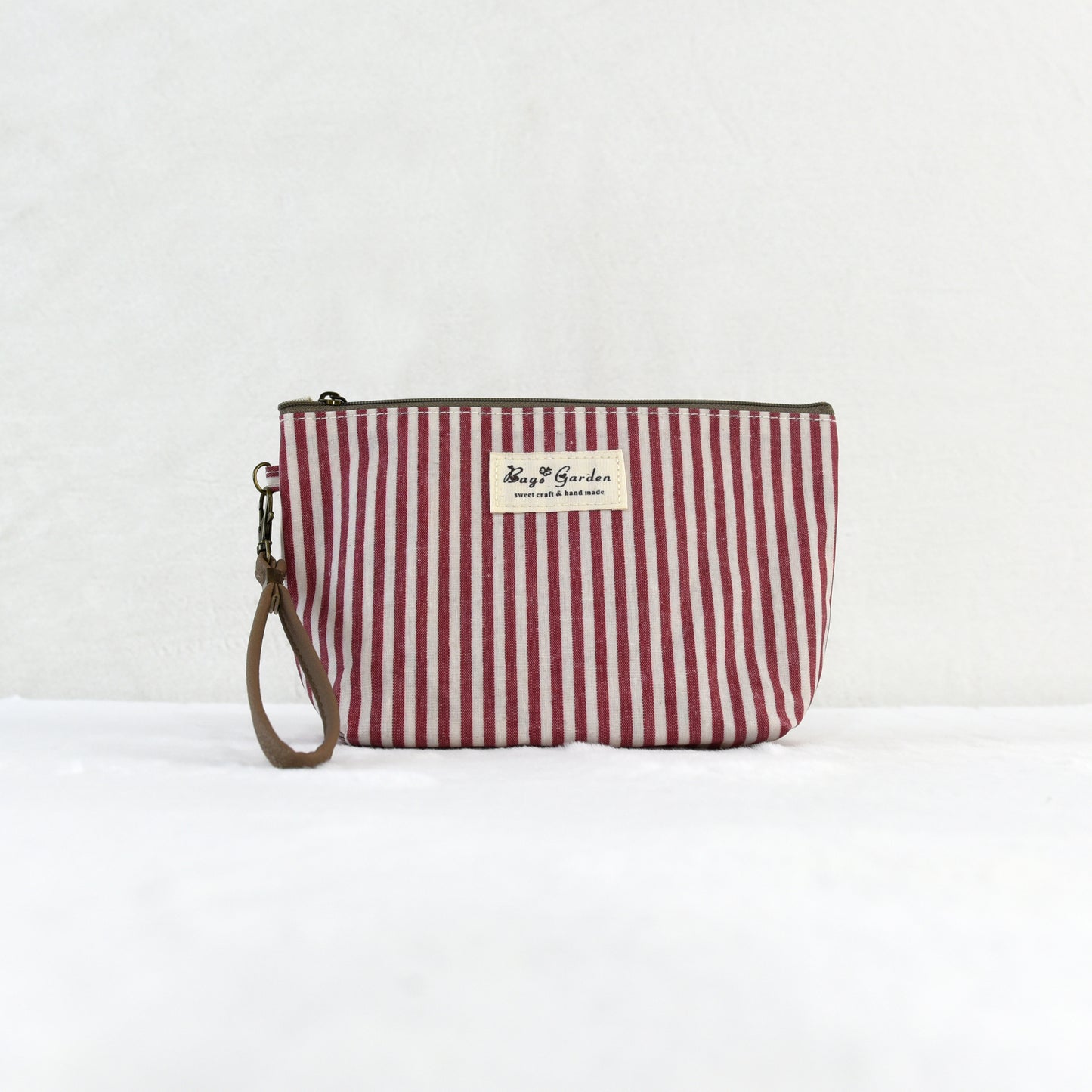 Neceser pequeño impermeable a rayas con cremallera, práctico para maquillaje y accesorios
