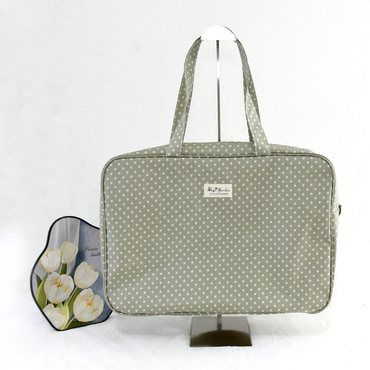Maletita impermeable de lunares grande