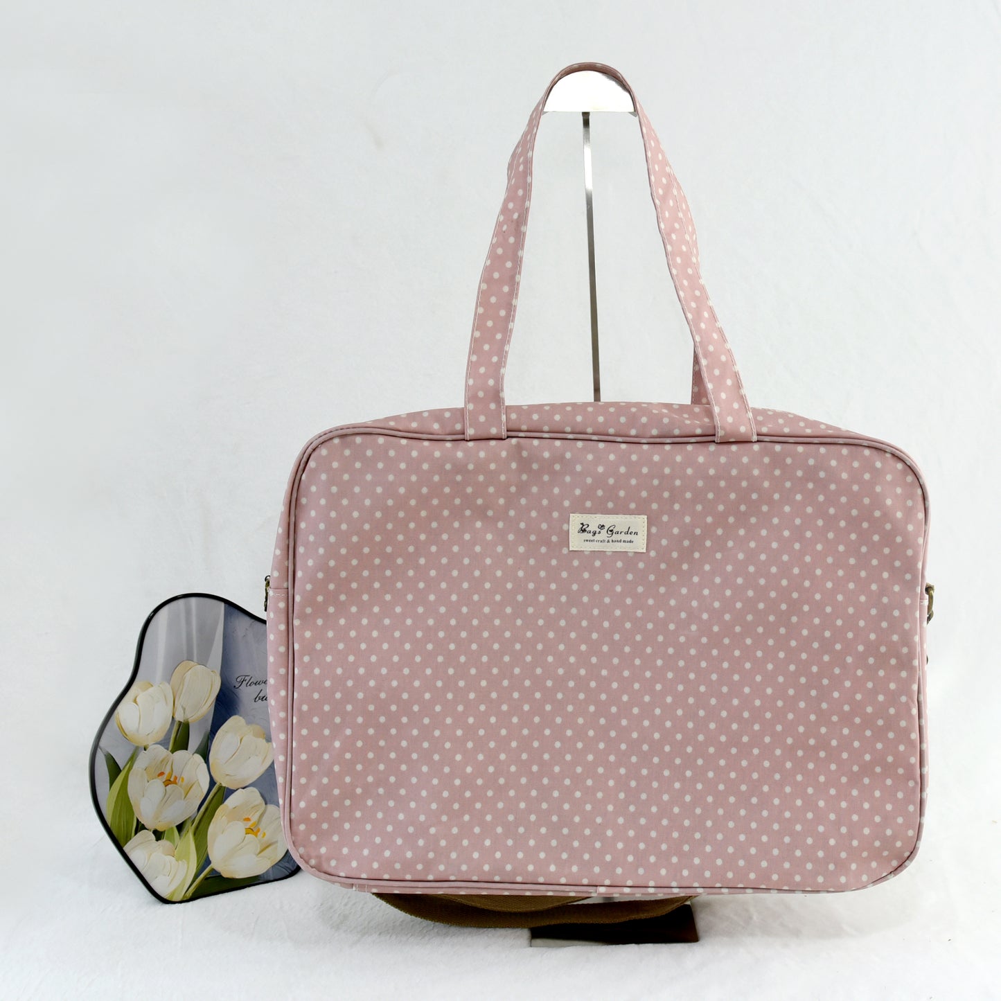 Maletita impermeable de lunares grande